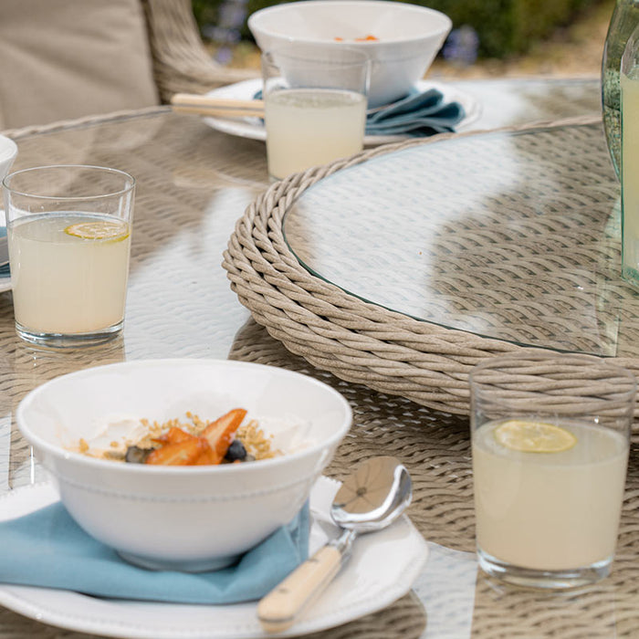Bramblecrest Chedworth 6 Seat Garden Dining Set in Sandstone with Round Table, Lazy Susan, 3m Parasol & Base