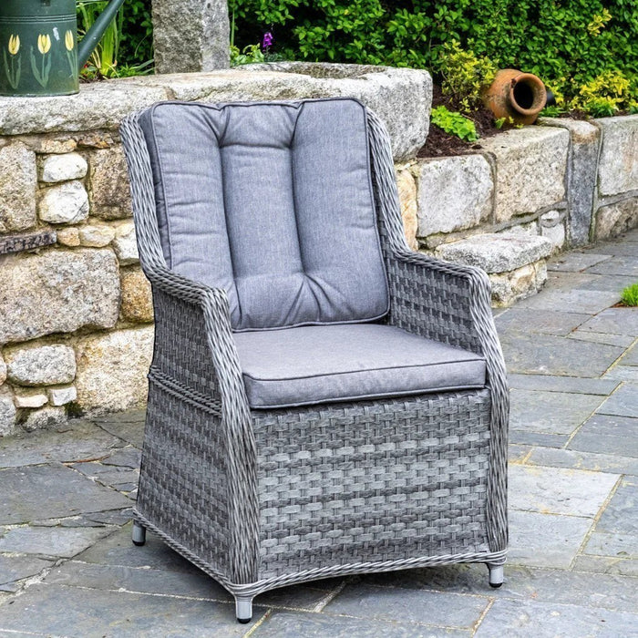 Mid Ulster Garden Centre Bali grey synthetic rattan dining chair with plush weatherproof cushions on a stone patio.