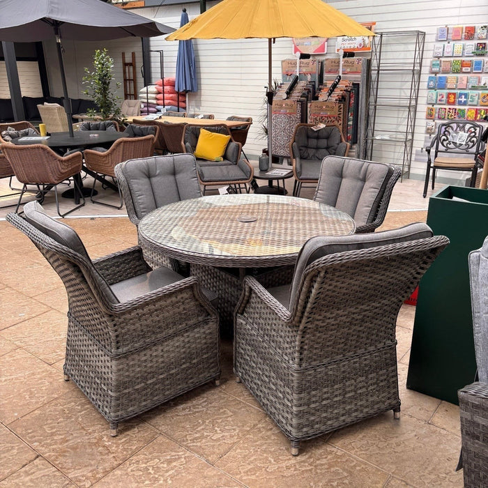 Mid Ulster Garden Centre Bali grey synthetic rattan 4-seat dining set with round glass-top table and cushioned chairs.