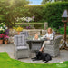 Mid Ulster Garden Centre Bali grey rattan 4-seat dining set with round glass table and cushions on a garden patio