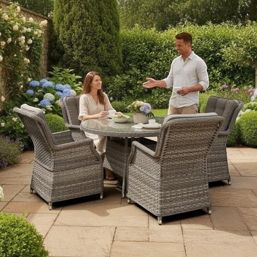 Mid Ulster Garden Centre Bali grey rattan 4-seat dining set with round glass table and cushions on a patio.
