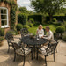 Mid Ulster Garden Centre Bramblecrest Venice 6-seater bronze aluminium dining set with parasol on a garden patio.