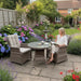 Mid Ulster Garden Centre Hampton 2 seat bistro set with light brown synthetic rattan chairs and glass top table in garden