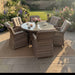 Mid Ulster Garden Centre Hampton 6 seat round rattan dining set with beige cushions in a lush flower garden